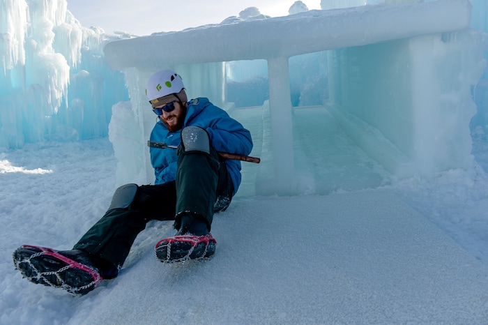 Leah Hogsten | The Salt Lake Tribune Todd Ogilvie takes the kiddie ice slide down after smoothing the top of the slide, Friday, Jan. 4, 2019.. "It's a blast," said Ogilvie, "I always tell people I would work here for free. The idea started with a backyard castle in Alpine followed by an ice castle in downtown Midway in 2009. Ice Castles is open for the winter Saturday, Jan. 5, at Homestead Resort. This is the ninth season the popular frozen art installation is drawing visitors to walk around the giant LED-lit icicle formations.