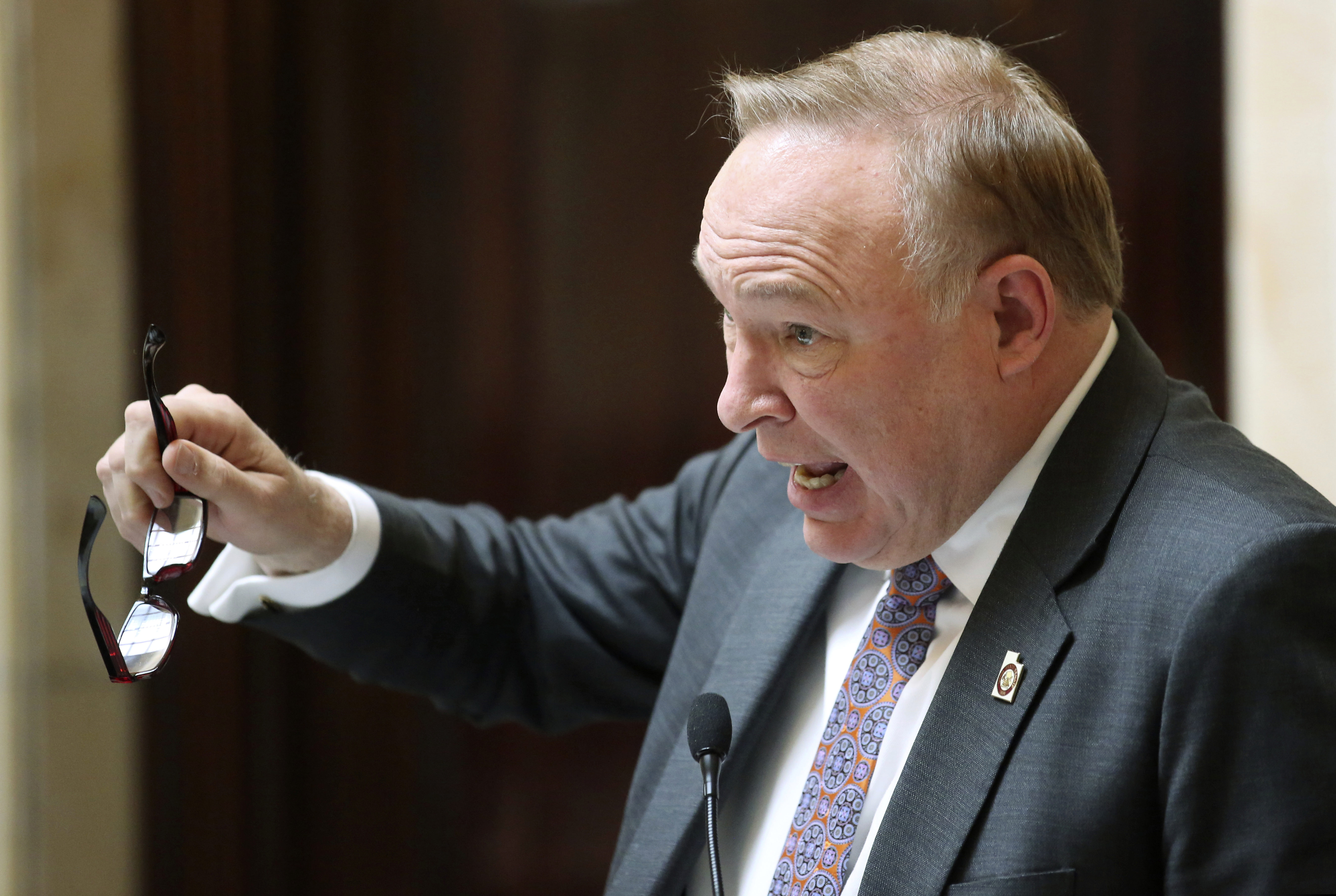 FILE - In this Feb. 20, 2018, file photo, Sen. Jim Dabakis, D-Salt Lake City, speaks on the Senate floor at the Utah State Capitol, in Salt Lake City. Dabakis drove to Las Vegas and tried marijuana for the first time ahead of an upcoming vote on a proposition that would legalize the medical use of marijuana in his state for individuals with qualifying medical conditions. Salt Lake City TV station KUTV reports Sen. Jim Dabakis wanted to try cannabis before the vote. Dabakis selected an edible gummy bear for the test, saying legislators should at least try marijuana before it's up for vote next month. (AP Photo/Rick Bowmer, File)