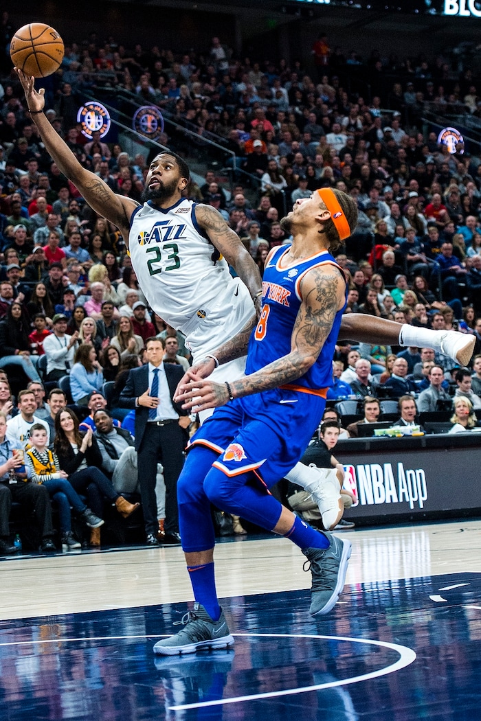 (Chris Detrick  |  The Salt Lake Tribune)  Utah Jazz forward Royce O'Neale (23) shoots past New York Knicks forward Michael Beasley (8) during the game at Vivint Smart Home Arena Friday, January 19, 2018.  