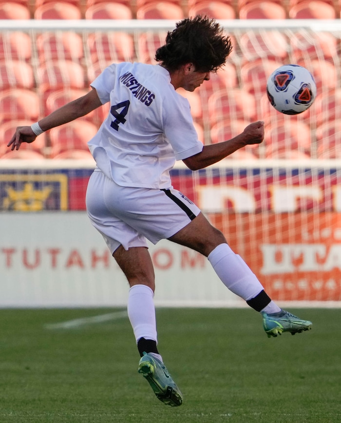 (Francisco Kjolseth | The Salt Lake Tribune) Herriman's Jason R. Dunham (4) works to bring down the ball during the 6A State Soccer Championship title game against Davis at Rio Tinto Stadium, Wednesday, May 25, 2022. Herriman defeated Davis 1-0 with two seconds left on the clock.