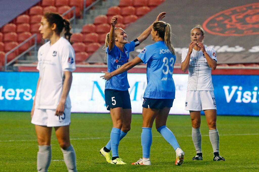 Chicago Red Stars' Rachel Hill (5) celebrates with teammate Katie Johnson (33) after scoring against the Sky Blue during the first half of an NWSL Challenge Cup soccer semifinal match Wednesday, July 22, 2020, in Sandy, Utah. (AP Photo/Rick Bowmer)