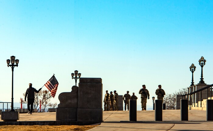 (Rick Egan | The Salt Lake Tribune) Jim White walks back and forth infront of the State Capitol with a tattered American Flag, protesting the corruption politicians and praying that God will change their hearts, on Tuesday Jan. 19, 2021.
