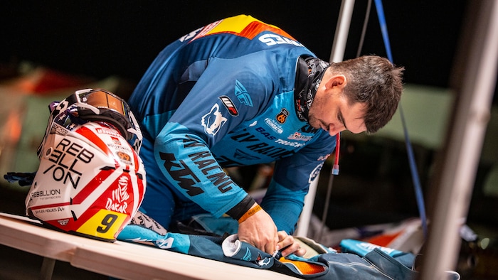 (Photo courtesy of Ishaan Bhataiya/BAS Trucks Dakar Racing Team)
Skyler Howes of St. George prepares his gear prior to racing a motorcycle through the dunes of Saudi Arabia during an early stage of the Dakar Rally in January 2021. Howes took the overall lead on Stage 3 and is believed to be one of the first privateers to lead the standings in more than 30 years.