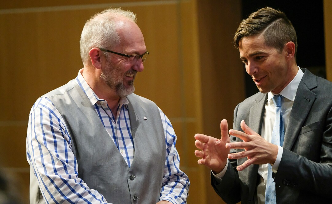 (Francisco Kjolseth  |  The Salt Lake Tribune)  Stan Penfold, left, and David Garbett speak prior to a debate for Salt Lake City mayor as they gather with the other candidates at Lake City Library on Wed. June 26, 2019.