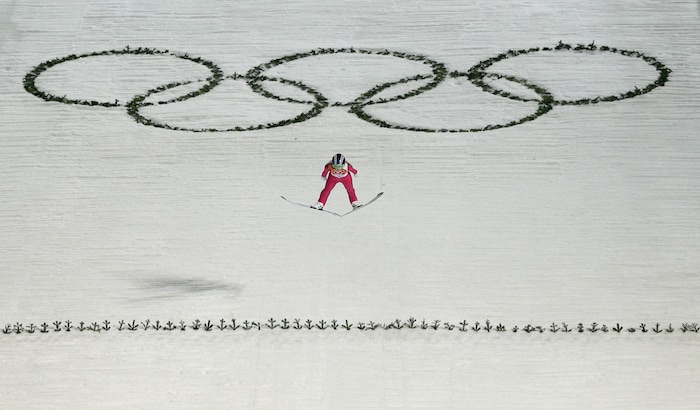 United States' Sarah Hendrickson makes the first attempt during the women's normal hill ski jumping final at the 2014 Winter Olympics, Tuesday, Feb. 11, 2014, in Krasnaya Polyana, Russia. (AP Photo/Matthias Schrader)