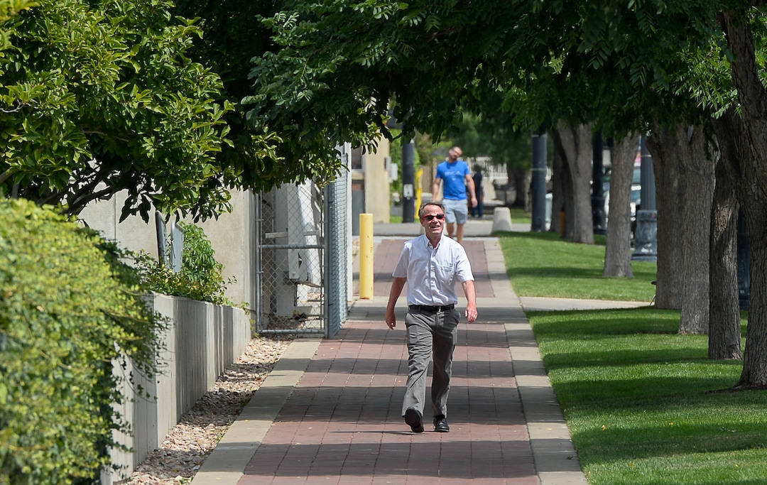 (Francisco Kjolseth  |  The Salt Lake Tribune)  Salt Lake Tribune editor Dave Noyce finishes his race against colleagues after using his own two feet in a transportation race from Library Square to the Tribune building at the Gateway on Thursday, Aug. 2, 2018. Modes of transportation included, rentable electric scooters, Green Bike, TRAX, Lyft, and walking.