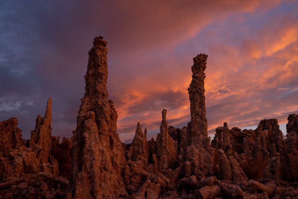 (Spenser Heaps | Deseret News) The sun sets over some of Mono Lake’s iconic tufa structures on the south shore of the lake in Mono County, California, on Tuesday, Aug. 9, 2022. The tufa are a symbol of how much Mono Lake has shrunk — they were submerged before the city of Los Angeles began diverting away the lake's water.