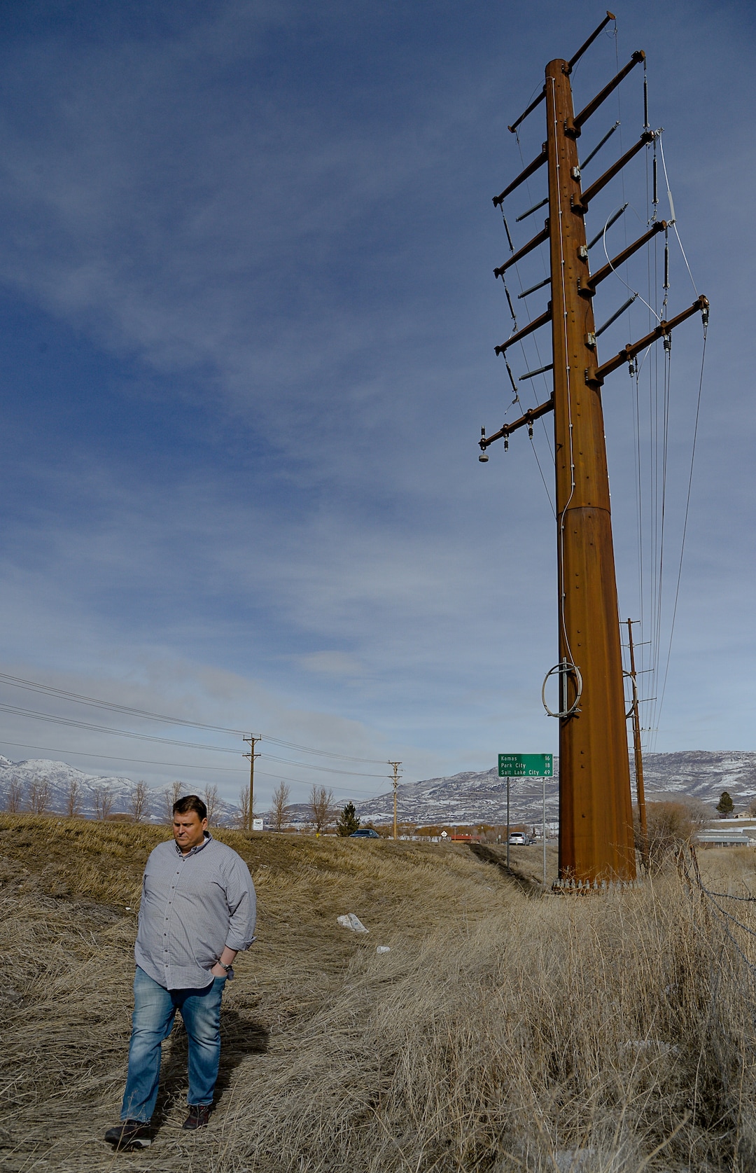 (Francisco Kjolseth  |  The Salt Lake Tribune) A large high powered dual 138-kV turn line power pole stands on the edge of Heber City as Midway residents, including Bengt Jonsson, talks about trying to convince Rocky Mountain Power to bury part of the transmission line the utility wants to build through the scenic Heber Valley town to the west. They are even willing to cover the cost, but the utility is challenging the town's requirement that the new line go underground.