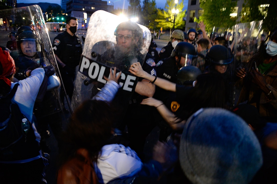 (Francisco Kjolseth  |  The Salt Lake Tribune) Police try to push their line against hundreds of protesters in Salt Lake City on Saturday, May 30, 2020.
