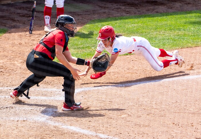 (Rick Egan | The Salt Lake Tribune)  Haley Denning beats the throw to score for Utah, in NCAA Softball Super Regionals action between the Utah Utes and the San Diego State Aztecs, on Saturday, May 27, 2023.
