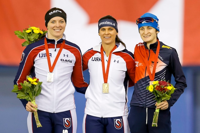 Second-place Heather Bergsman. left; winner Brittany Bowe, both of the United States; and third-place Martina Sablikova, of the Czech Republic, share the podium after the women's 1,500 meters at the World Cup speedskating event in Calgary, Alberta, Sunday, Nov. 15, 2015. (Lyle Aspinall/The Canadian Press via AP)