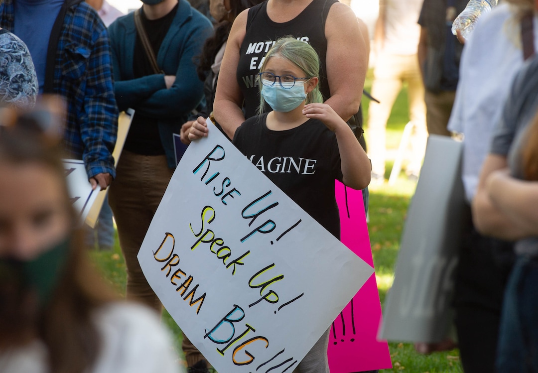 (Francisco Kjolseth  |  The Salt Lake Tribune) Akasha Schmidt, 9, joins her mother Shalee and other demonstrators gathered in Salt Lake City, as they unite with Women’s March rallies happening in Washington D.C. and around the country on Saturday, Oct. 17, 2020, to signal their opposition to President Donald Trump and his agenda, including his push to fill the seat of late Supreme Court Justice Ruth Bader Ginsburg before election day.