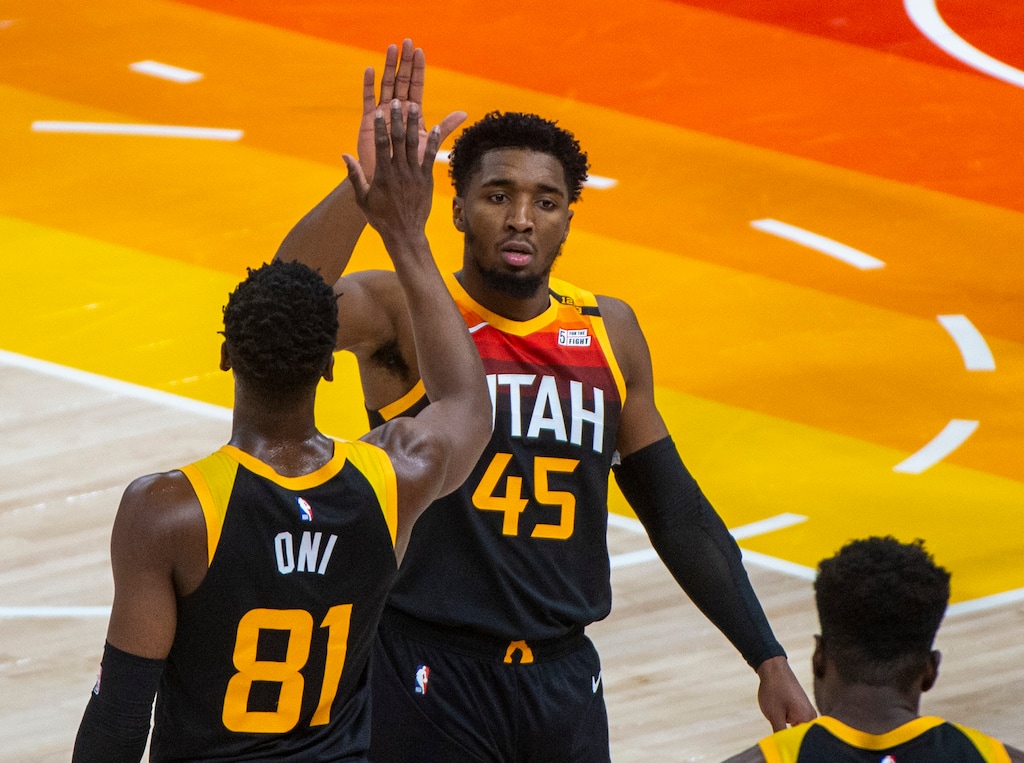 (Rick Egan | The Salt Lake Tribune) Utah Jazz guard Donovan Mitchell (45) gets a high-five from Utah Jazz guard Miye Oni (81) as he leaves the game part way through the 4th quarter with 26 points, in NBA action between the Utah Jazz and the Atlanta Hawks at Vivint Arena, on Friday, Jan. 15, 2021.  