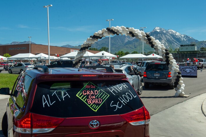 (Rick Egan  |  The Salt Lake Tribune)     Alta High seniors join in the parade of 2020 graduates in a “drive through” graduation ceremony at Alta High, Thursday, May 28, 2020.