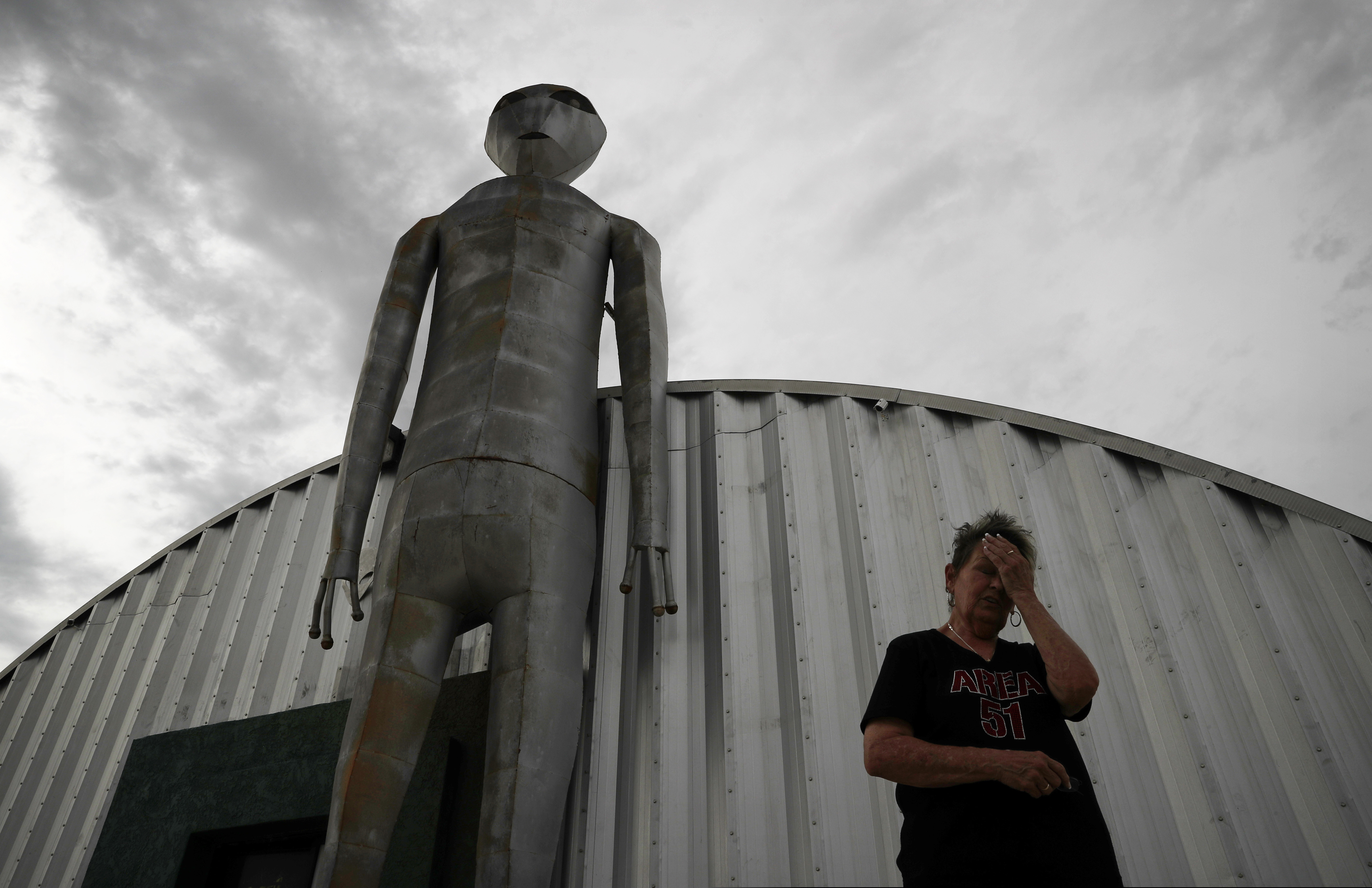 (John Locher | AP Photo) In this July 22, 2019 photo, Linda Looney wipes her face outside of the Alien Research Center, a gift shop on the Extraterrestrial Highway, in Crystal Springs, Nev. The U.S. Air Force has warned people against participating in an internet joke suggesting a large crowd of people "storm Area 51," the top-secret Cold War test site in the Nevada desert. "It was funny at first but now It's nuts," says Looney about all the interest in the facebook event.
