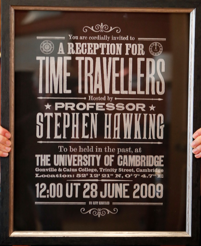 A poster advertising Time Travellers meeting hosted by Stephen Hawking, is one of the personal and academic possessions of Stephen Hawking at the auction house Christies in London, Friday, Oct. 19, 2018. The online auction announced Monday Oct. 22, 2018, by auctioneer Christie’s features 22 items from Hawking, including his doctoral thesis on the origins of the universe, with the sale scheduled for 31 October and 8 November. (AP Photo/Frank Augstein)
