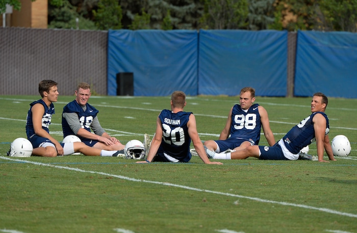 (Francisco Kjolseth  |  The Salt Lake Tribune)  BYU opens preseason training camp on their practice field as the team members cool down following drills on Thursday, Aug. 2, 2018.