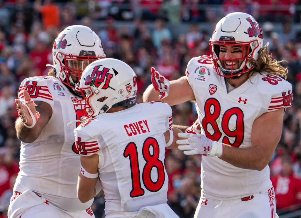 (Rick Egan | The Salt Lake Tribune) Teammates celebrate with Utah wide receiver Britain Covey (18) after he scored the first touchdown for the Utes, in the action, between Utah Utes and Ohio State Buckeyes in the Rose Bowl in Pasadena, Calif., on Saturday, Jan. 1, 2022.