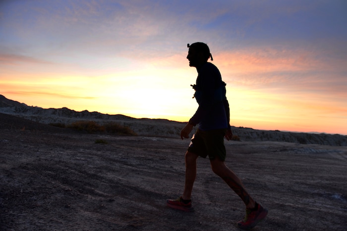(Scott Sommerdorf | The Salt Lake Tribune)
Alex Doolan sets out on the last 3.8 miles as the sun rises at the Salt Flats 100 Endurance Run, Saturday, May 5, 2018. Doolan finished the race in 8th place.
