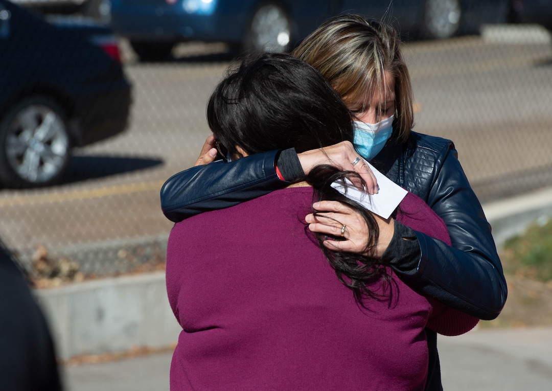 (Francisco Kjolseth  |  The Salt Lake Tribune) Jill McCluskey shares a long embrace with her daughter’s friend Alex, who asked to only use her first name for privacy reasons, as they attend a memorial walk on the two-year anniversary of Lauren McCluskey’s murder on Thursday, Oct. 22, 2020. Alex went to the police station with Lauren when she first went to report she was being stalked by someone she previously dated.