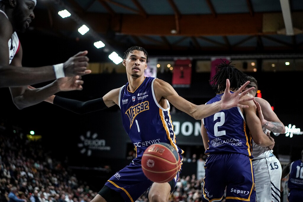 (Laurent Cipriani | AP) Boulogne-Levallois' Victor Wembanyama follows the ball during the Elite basketball match Boulogne-Levallois against JDA Dijon at the Palais de Sports Jean-Michel Geoffroy in Dijon, central France, Sunday, Jan. 15, 2023. On Sunday, May 7, 2023, he played before a crowd of about 15,000 fans in Paris as part of his farewell tour before coming to the NBA. Wembanyama is just hours away from learning which team will pick him in the NBA Draft.