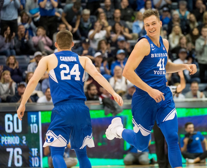 (Rick Egan  |  The Salt Lake Tribune)  Brigham Young guard McKay Cannon (24) and forward Luke Worthington (41) smile as the Cougars take a 16 point lead on on Woerthingtons basket, in basketball action Utah Utes vs. Brigham Young Cougars at the Marriott Center in Provo, Saturday, December 15, 2017.


