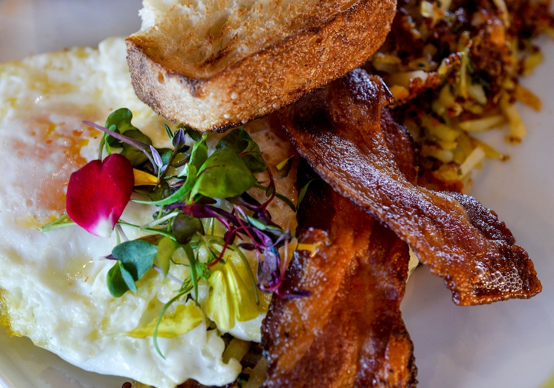 (Leah Hogsten  |  The Salt Lake Tribune) Cotton KitchenÕs 2 Egg CK served with quinoa potato hash, choice of bacon or maple pork sausage, toast and jam, $11. Cotton Kitchen serves an all-day breakfast and lunch. While a global influence is apparent, the menu feels most cohesive around the clean-eating concept, focusing on health-conscious and plant-based dishes made with as few ingredients as possible.