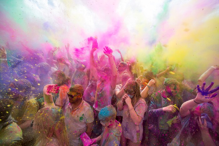 (Rick Egan  |  The Salt Lake Tribune)     Revelers celebrate spring as they toss colored powder into the air, during the 22nd annual Holi Festival of Colors at the Sri Sri Radha Krishna Temple in Spanish Fork, Saturday, March 24, 2018. The festival which celebrates the beginning or spring is also known as at the Festival of Love.