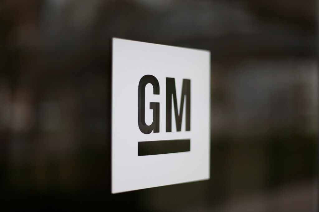FILE - This Friday, May 16 2014, file photo, shows the General Motors logo at the company's world headquarters in Detroit. On Monday, Jan. 4, 2016, General Motors Co. announced it is investing $500 million in ride-sharing company Lyft Inc. GM gets a seat on Lyfts board as part of the partnership, which could speed the development of on-demand, self-driving cars. (AP Photo/Paul Sancya, File)
