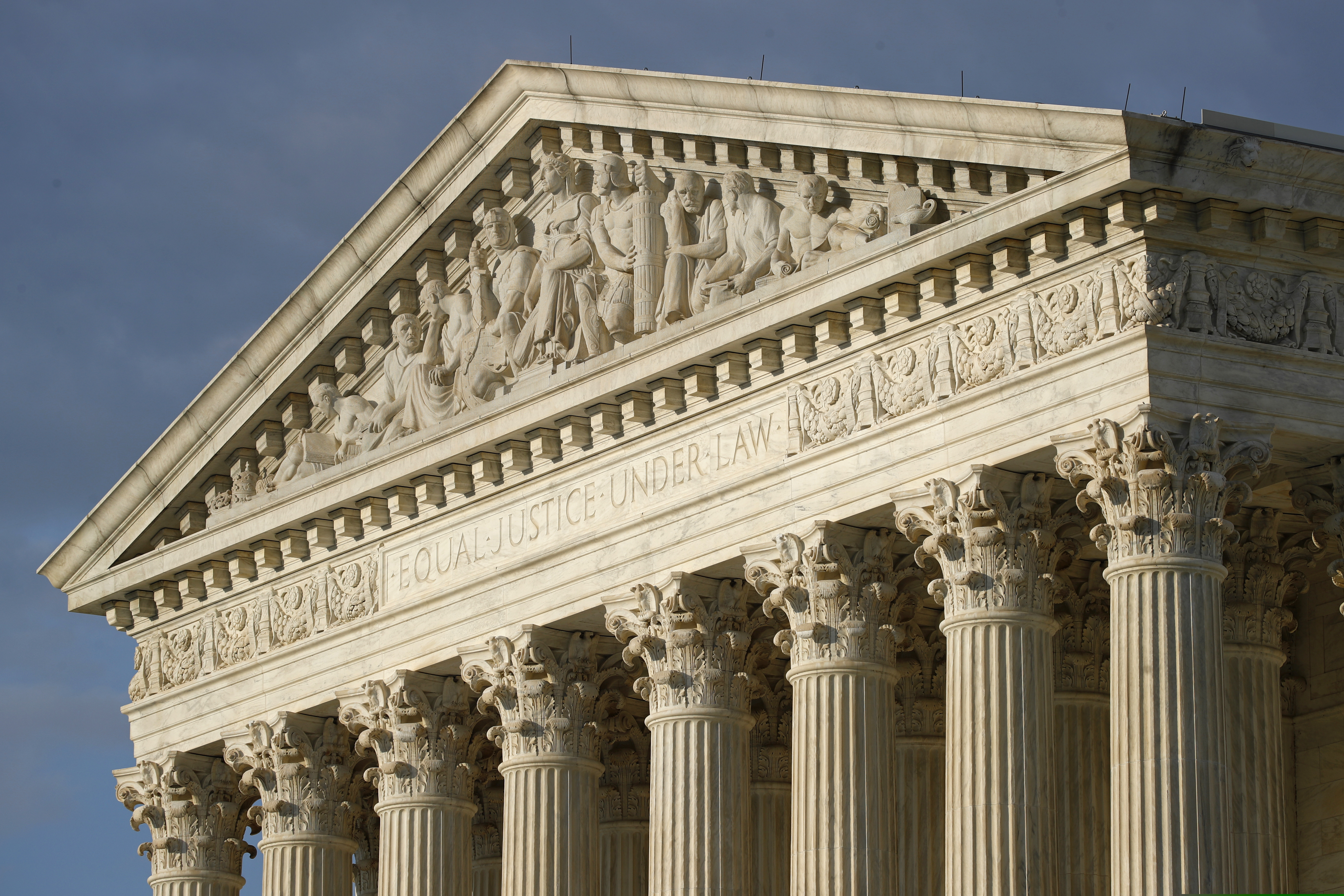 (Patrick Semansky | AP file photo)  The setting sun shines on the Supreme Court building on Capitol Hill in Washington on May 3, 2020.