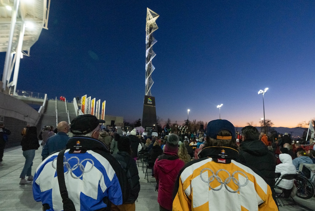 (Francisco Kjolseth | The Salt Lake Tribune) People gather near the Olympic cauldron before it is lit up on the 20-year anniversary of the Salt Lake 2002 Olympic Opening Ceremony at Rice-Eccles Stadium on Feb. 8, 2022. U.S. Olympic officials say they support Salt Lake's bid to host another games despite having some concerns about the state's new transgender sports law.