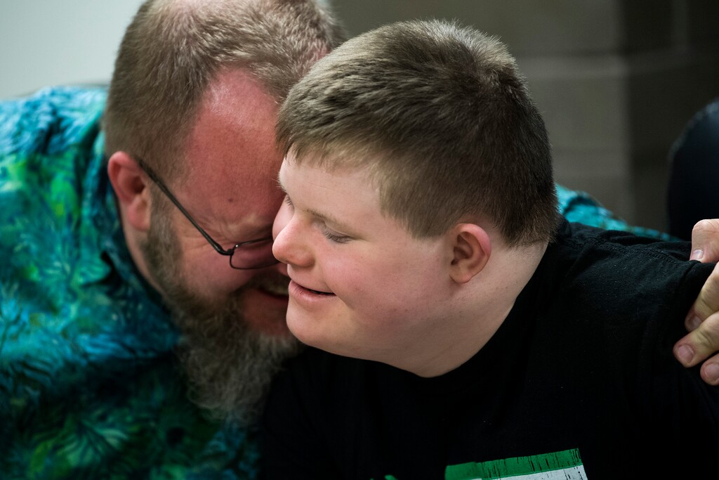 (Chris Detrick  |  The Salt Lake Tribune)  Chad Blythe hugs his son Logan, 15, during an interview at VF Law in Salt Lake City Friday, March 16, 2018.