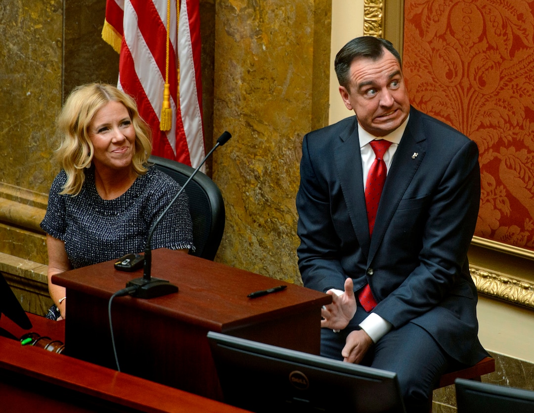 (Steve Griffin  |  The Salt Lake Tribune) Joined by his wife Krista, Utah House Speaker Greg Hughes jokes around as he gives a nervous wave to friends in the gallery as he prepares to give his opening remarks at the start of the 2018 Legislative session at the Utah State Capitol in Salt Lake City Monday January 22, 2018.