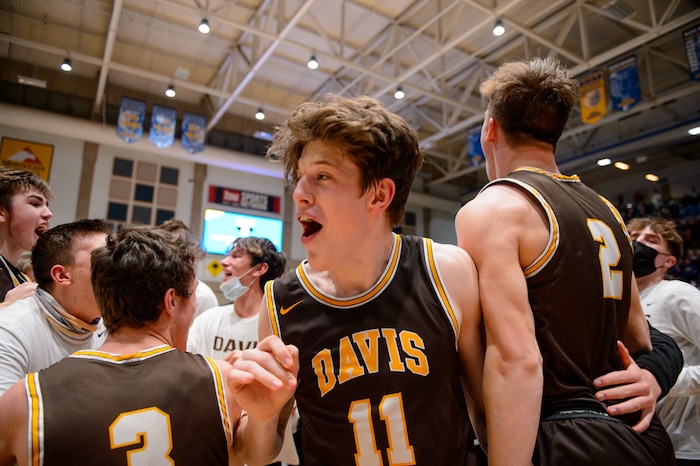(Trent Nelson  |  The Salt Lake Tribune) Davis players celebrate after defeating Westlake High School in the 6A boys basketball state championship game, in Taylorsville on Saturday, March 6, 2021.