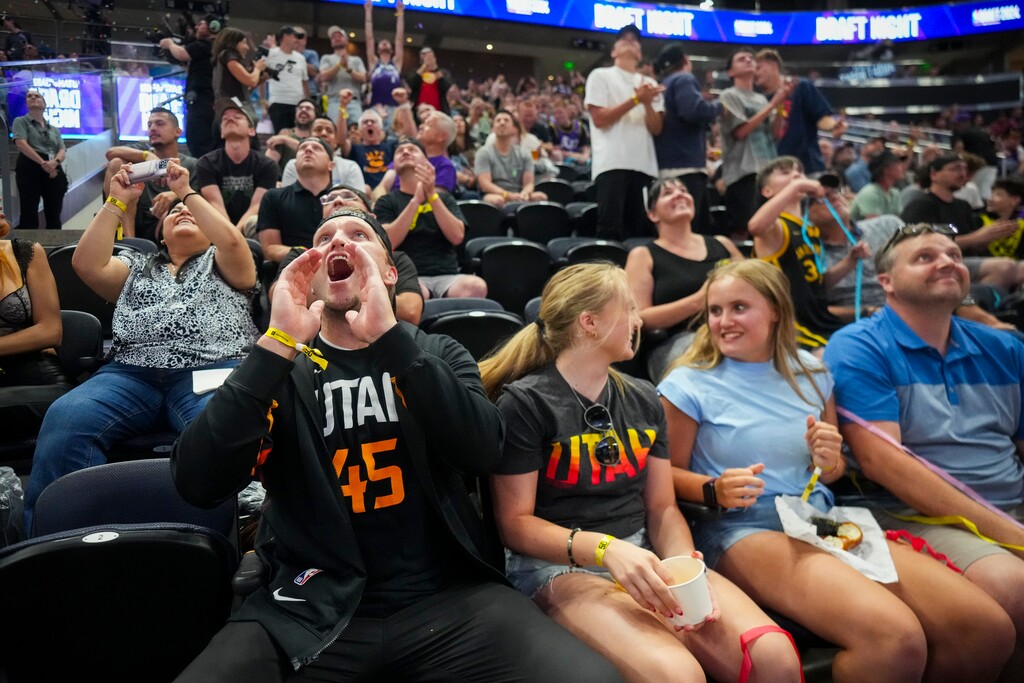 (Bethany Baker | The Salt Lake Tribune) Fans react to Cody Williams being selected as the tenth pick during the NBA draft party at the Delta Center in Salt Lake City on Wednesday, June 26, 2024.