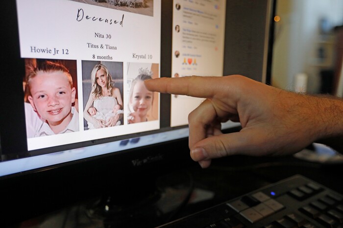 Austin Cloes points to a photo of relatives Rhonita Miller and her family, who were killed in Mexico, on a computer screen Tuesday, Nov. 5, 2019, in Herriman, Utah. Drug cartel gunmen ambushed three SUVs along a dirt road, slaughtering at least six children and three women all of them U.S. citizens living in northern Mexico in a grisly attack that left one vehicle a burned-out, bullet-riddled hulk, authorities said Tuesday, Nov. 5, 2019. (AP Photo/Rick Bowmer)