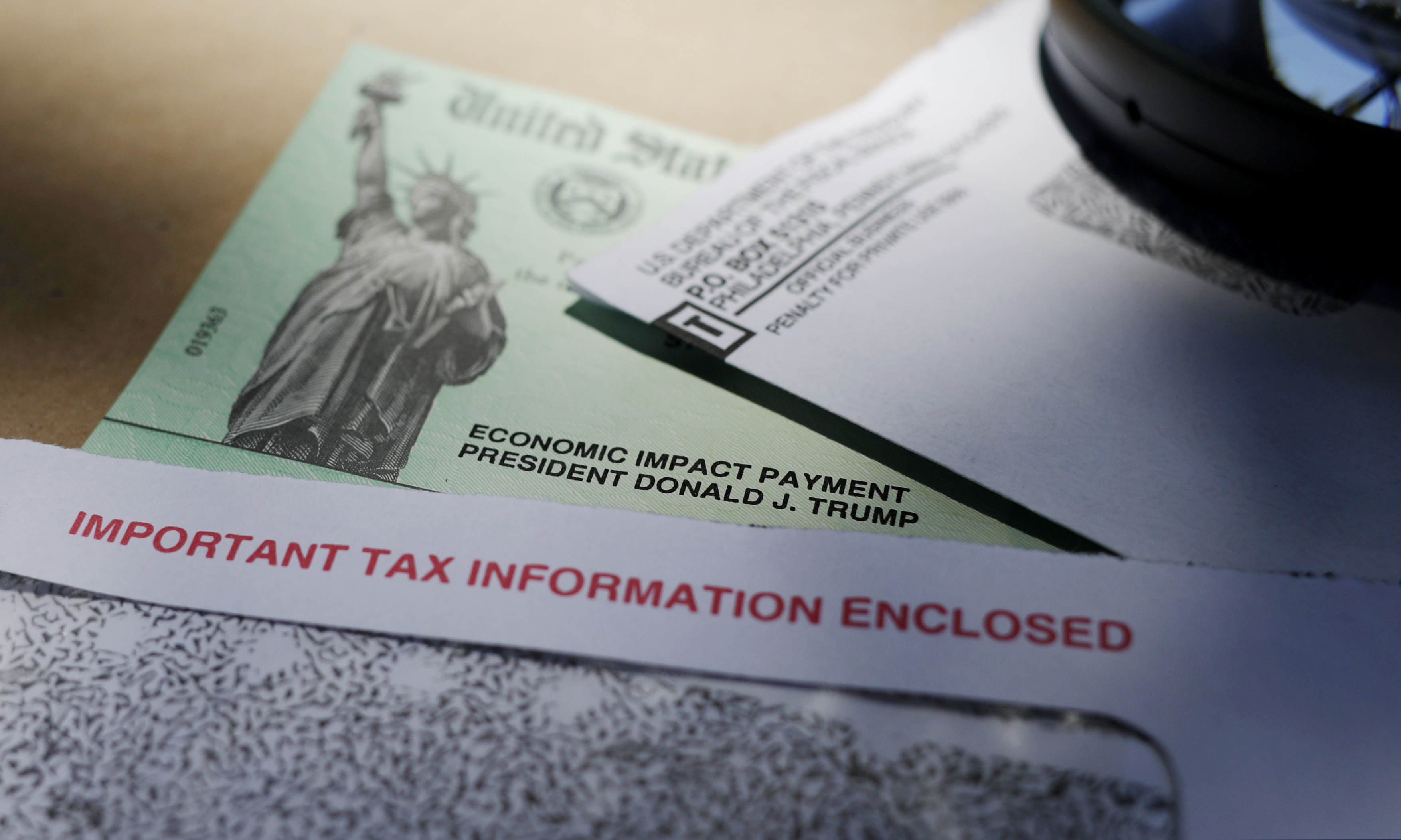 (Eric Gay | AP file photo) In this April 23 photo, President Donald Trump's name is seen on a stimulus check issued by the IRS to help combat the adverse economic effects of the COVID-19 outbreak, in San Antonio.
