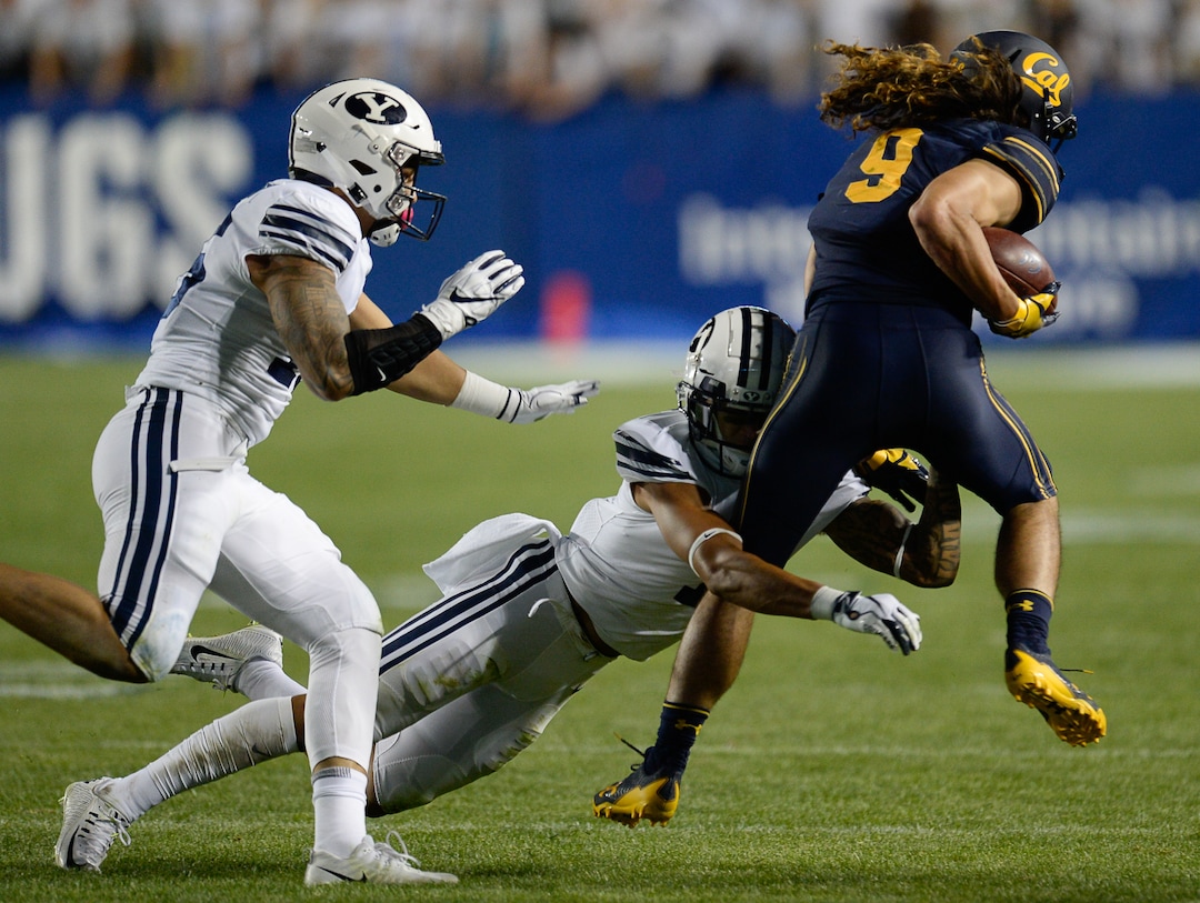 (Francisco Kjolseth  |  The Salt Lake Tribune)  Brigham Young Cougars defensive back Troy Warner (1) moves in on California Golden Bears wide receiver Kanawai Noa (9) during the second half of the NCAA college football game, Saturday, Sept. 8, 2018, at LaVell Edwards stadium in Provo, Utah.