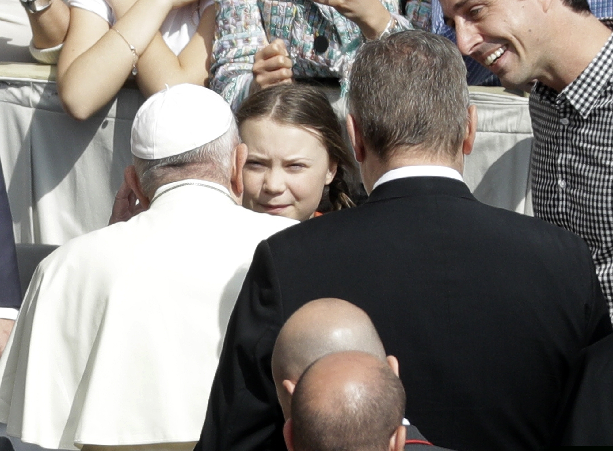 (Gregorio Borgia | AP file photo)  Pope Francis, back to camera, greets Swedish teenage environmental activist Greta Thunberg, center, during his weekly general audience in St. Peter's Square, at the Vatican on Wednesday, April 17, 2019.