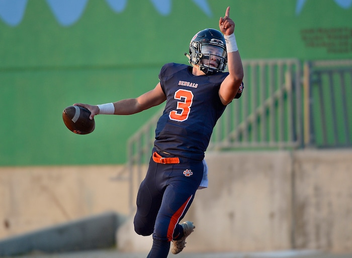 (Scott Sommerdorf   |  The Salt Lake Tribune)   
Brighton QB Alexander Zettler celebrates his 63 yard TD scamper to give Brighton an early 7-0 lead. Skyline held a 14-10 lead at the half over Brighton, Friday, September 15, 2017.