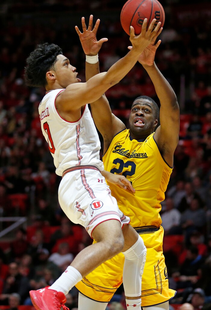 Utah guard Sedrick Barefield, left, lays the ball up as California center Kingsley Okoroh (22) defends during the second half during an NCAA college basketball game Saturday, Feb. 10, 2018, in Salt Lake City. (AP Photo/Rick Bowmer)