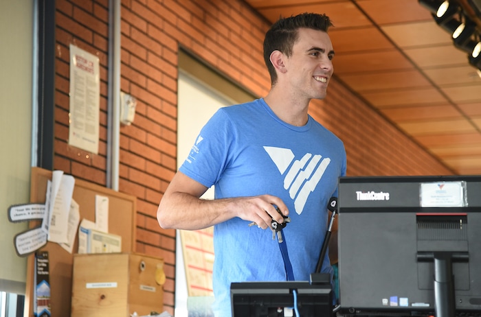 (Francisco Kjolseth | The Salt Lake Tribune) Ballet West dancer Lucas Horns runs through numerous tasks as he takes a turn at the front desk during one of his Sunday volunteer shifts at the VOA Youth Resource Center in Salt Lake City. Horns who started volunteering over two years ago, also leads an LGBTQ support group.