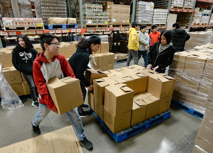 (Francisco Kjolseth  |  The Salt Lake Tribune) Members of YouthCity Government that involves teens in state-organized, model-government programs, volunteer their time assembling pallets of food at the Utah Food Bank on Monday, Jan. 20, 2020, to celebrate the 2020 Martin Luther King Jr. Day of Service.
