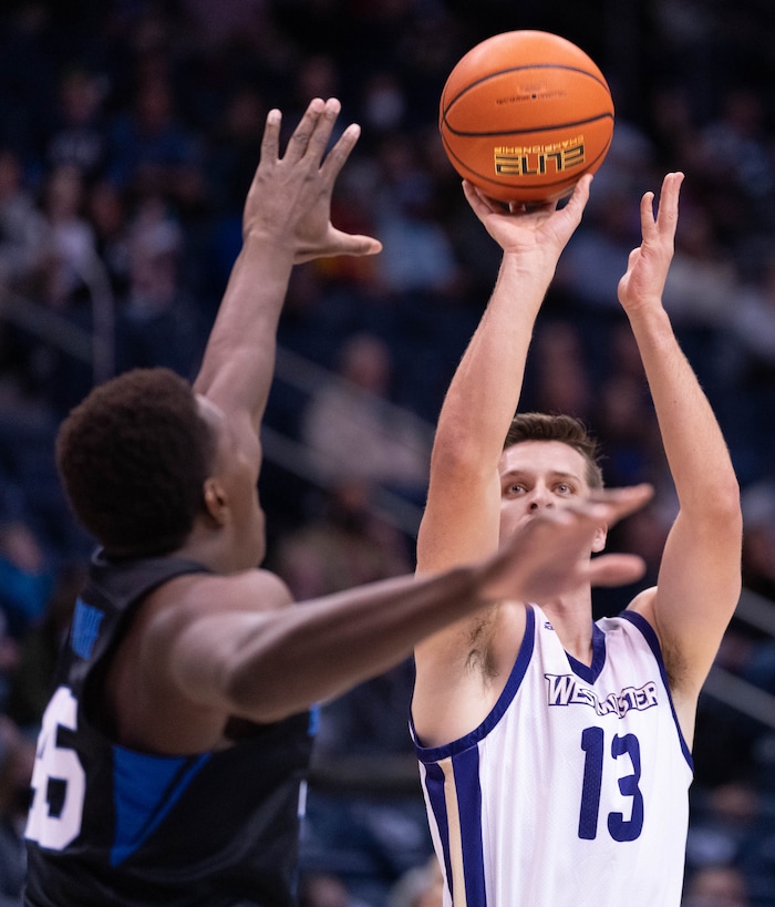 (Francisco Kjolseth | The Salt Lake Tribune) Brigham Young Cougars forward Fousseyni Traore (45) tries to block Westminster Griffins forward Brayden Johnson (13) in basketball action between the Brigham Young Cougars and the Westminster Griffins at the Marriott Center in Provo, Wednesday, Dec. 29, 2021.