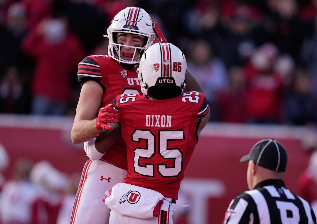 (Francisco Kjolseth | The Salt Lake Tribune) Utah Utes tight end Dalton Kincaid (86) celebrates his touchdown with Utah Utes wide receiver Jaylen Dixon (25) as the University of Utah hosts the Colorado Buffaloes in Pac-12 football, Friday, Nov. 26, 2021 at Rice-Eccles Stadium.