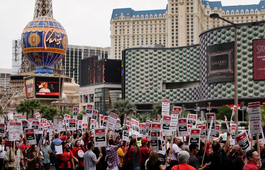 (Julie Jacobson | Associated Press file photo) In this March 20, 2013, file photo, Culinary Union workers demonstrate along Las Vegas Boulevard outside the Cosmopolitan Hotel and Casino while protesting their contract negotiations with Deutsche Bank in Las Vegas. The union representing thousands of Las Vegas casino workers estimates that the two largest resort operators would lose more than $10 million a day combined if housekeepers, cooks and others go on strike at any time starting Friday, June 1, 2018.