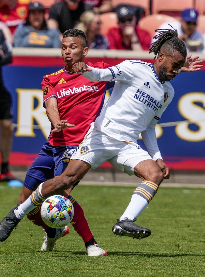 (Leah Hogsten | The Salt Lake Tribune) Real Salt Lake midfielder Maikel Chang (16) collides with Los Angeles Galaxy forward Raheem Edwards (44) as Real Salt Lake hosts LA Galaxy at Rio Tinto Stadium, Saturday, April 30, 2022.