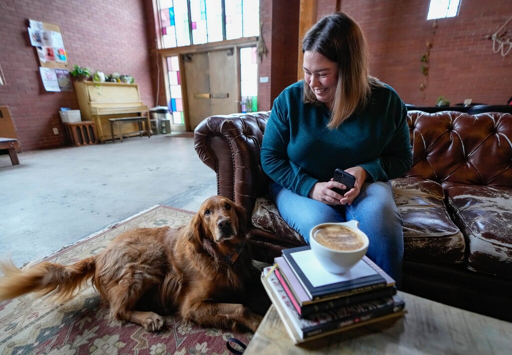 (Francisco Kjolseth | The Salt Lake Tribune) Brandy Chenoweth is joined by Scout, her 5-year-old golden retriever, as they check out Café Juniper, located inside the Church & State building in Salt Lake City, on Thursday, March 30, 2023.