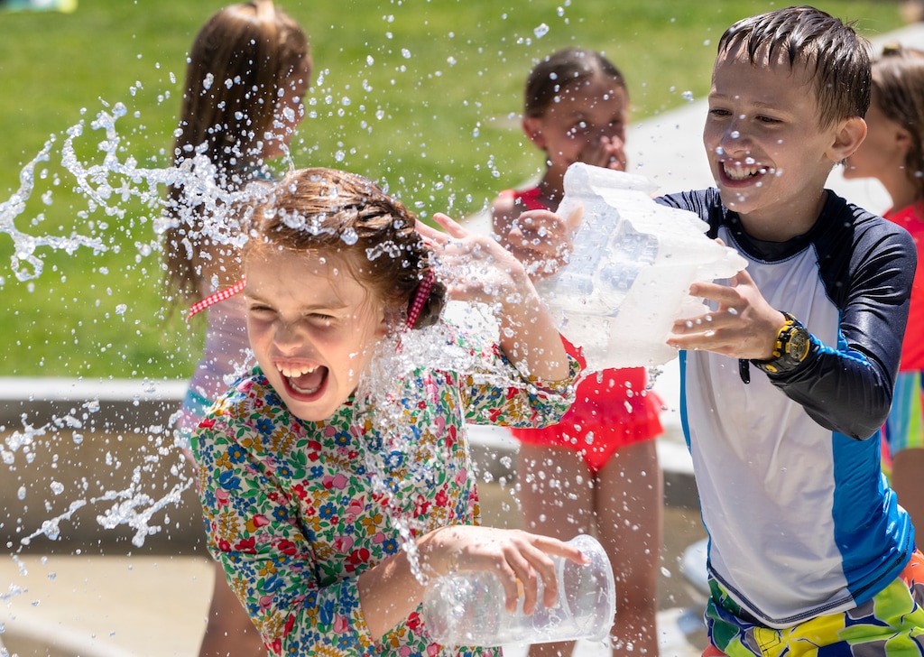 (Rick Egan | The Salt Lake Tribune) Clara Davidson, has a water fight with Keagan Stagg, at the Bountiful Town Center, on Friday, June 4, 2021.