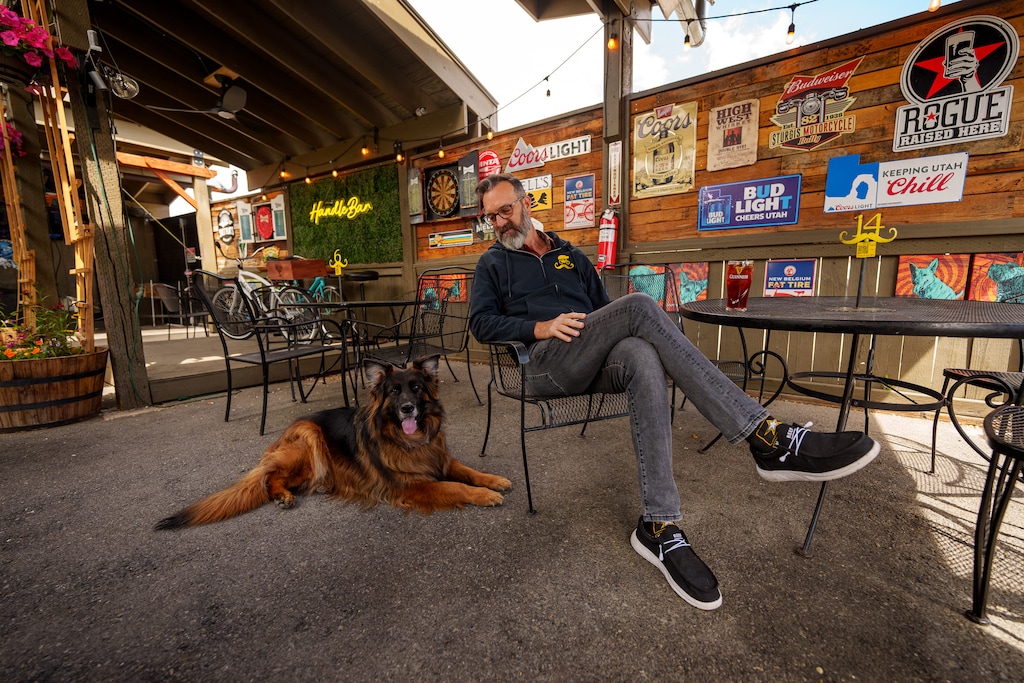 (Trent Nelson  |  The Salt Lake Tribune) Handle Bar co-owner Dave Norris and his dog Nola on the dog-friendly patio at Handle Bar in Salt Lake City on Thursday, May 9, 2024.